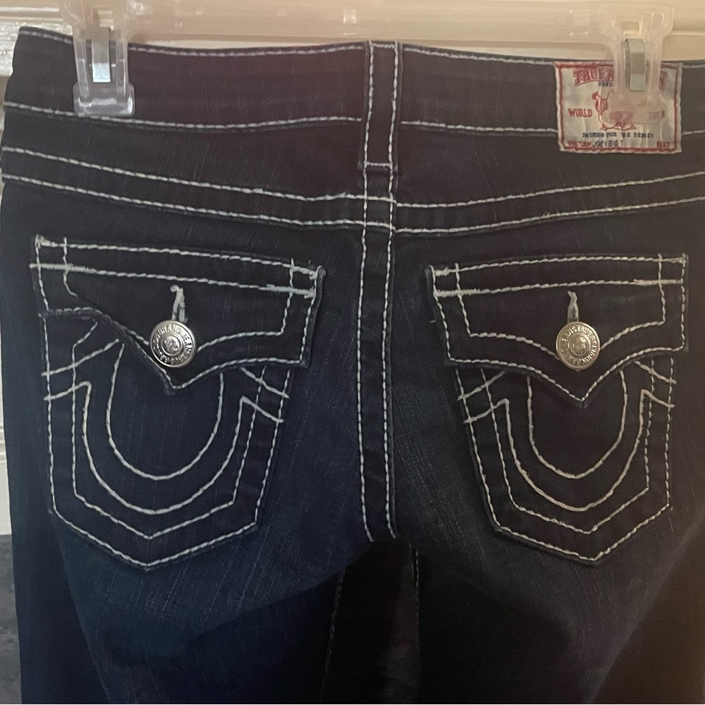 True Religion size 25 waist blue jeans.